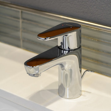 Chrome Faucet Mounted On a Quartz Countertop with Undermount Sink