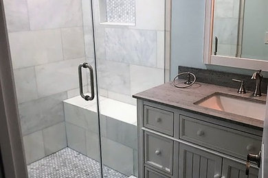 Small minimalist 3/4 gray tile, multicolored tile, white tile and porcelain tile porcelain tile and gray floor alcove shower photo in Los Angeles with recessed-panel cabinets, white cabinets, a two-piece toilet, blue walls, an undermount sink, quartzite countertops and a hinged shower door