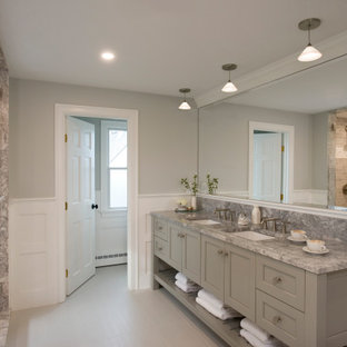 Example of a mid-sized beach style master porcelain tile, multicolored floor, double-sink and wainscoting bathroom design in Boston with furniture-like cabinets, gray cabinets, a two-piece toilet, multicolored walls, an undermount sink, quartzite countertops, a hinged shower door, gray countertops and a built-in vanity