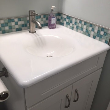 White Bathroom Vanity with Blue Mosaic Tile Backsplash