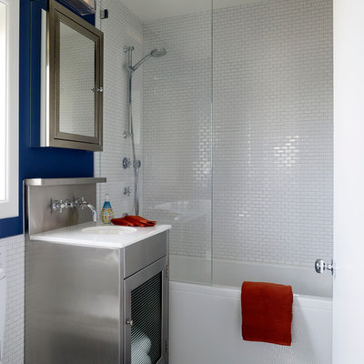 Trendy white tile bathroom photo in San Francisco with an undermount sink and glass-front cabinets