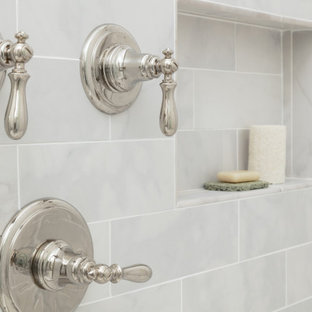 Large traditional master bathroom in Boston with recessed-panel cabinets, grey cabinets, an undermount tub, a corner shower, a two-piece toilet, beige walls, porcelain floors, an undermount sink, quartzite benchtops, grey floor, a hinged shower door and yellow benchtops.