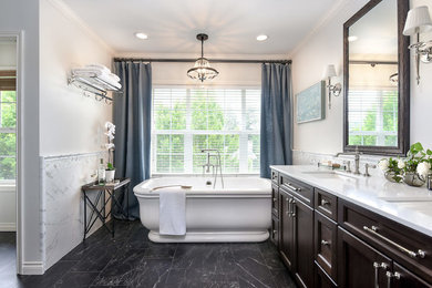 Bathroom - mid-sized transitional master black and white tile and porcelain tile porcelain tile and black floor bathroom idea in Seattle with recessed-panel cabinets, dark wood cabinets, a one-piece toilet, white walls, an undermount sink, quartzite countertops and white countertops