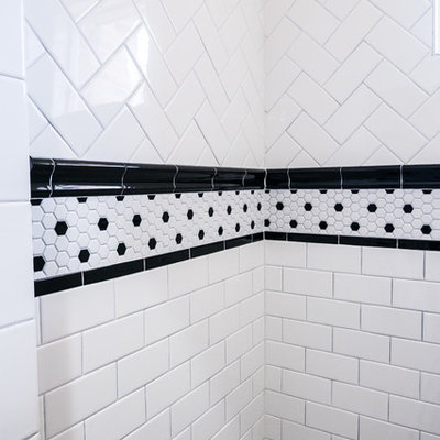 Example of a mid-sized classic master white tile and ceramic tile ceramic tile doorless shower design in Dallas with a console sink, flat-panel cabinets, black cabinets, marble countertops, a one-piece toilet and gray walls