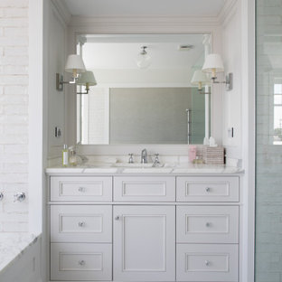 Photo of a traditional bathroom in Brisbane with white cabinets, an undermount tub, mosaic tile floors, marble benchtops, a built-in vanity, recessed-panel cabinets, a curbless shower, an undermount sink, white floor, white benchtops and a single vanity.