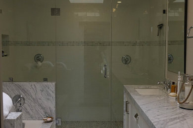 Bathroom - country master mosaic tile marble floor bathroom idea in Los Angeles with marble countertops