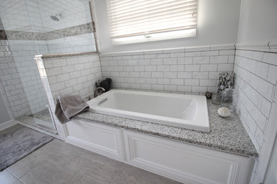 Mid-sized transitional master white tile and subway tile porcelain tile and gray floor bathroom photo in Chicago with gray walls and a hinged shower door