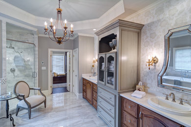 Example of a large classic master gray tile and stone tile porcelain tile and gray floor bathroom design in Atlanta with a drop-in sink, furniture-like cabinets, medium tone wood cabinets, quartzite countertops, gray walls and a hinged shower door