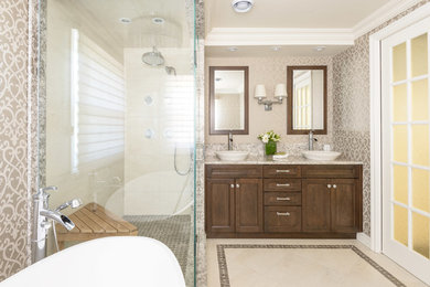Bathroom - mid-sized transitional master beige tile and porcelain tile ceramic tile and beige floor bathroom idea in Toronto with quartzite countertops, a vessel sink, recessed-panel cabinets, dark wood cabinets, gray walls and a hinged shower door