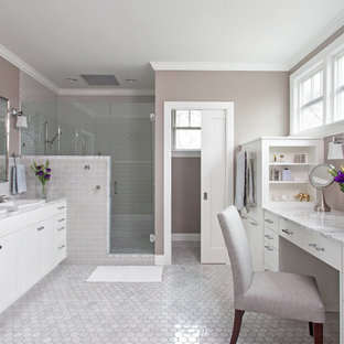 Mid-sized elegant master subway tile and gray tile marble floor corner shower photo in Austin with shaker cabinets, white cabinets, gray walls and marble countertops