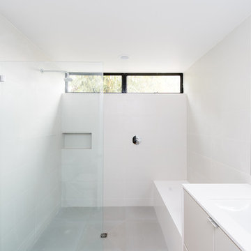 clean white minimalist open shower