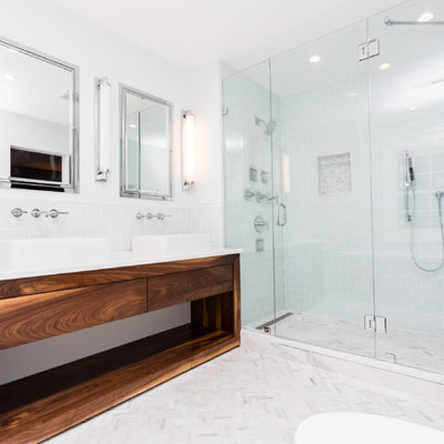 Trendy master white tile and subway tile mosaic tile floor freestanding bathtub photo in St Louis with open cabinets, medium tone wood cabinets, gray walls, a vessel sink and marble countertops
