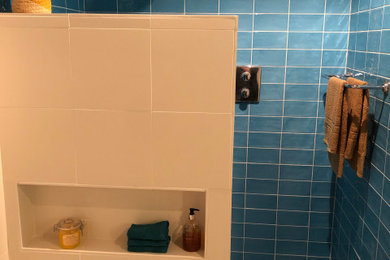 Photo of a medium sized mediterranean family bathroom in London with a built-in bath, a walk-in shower, blue tiles, ceramic tiles, ceramic flooring and an open shower.
