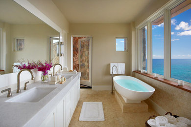 Inspiration for a mid-sized contemporary master freestanding bathtub remodel in Other with an undermount sink, recessed-panel cabinets, white cabinets, a one-piece toilet and beige walls