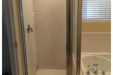 Bathroom - mid-sized traditional 3/4 white tile ceramic tile and beige floor bathroom idea in Salt Lake City with beige walls and a hinged shower door
