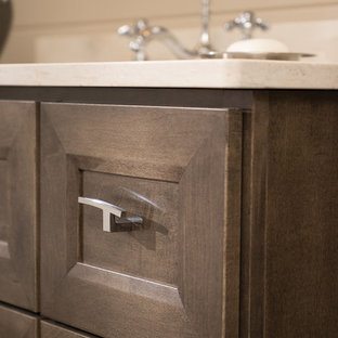 Mid-sized transitional master bathroom in Chicago with furniture-like cabinets, medium wood cabinets, beige tile, beige walls, cork floors, an undermount sink, solid surface benchtops, brown floor and beige benchtops.