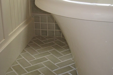 Example of a huge classic master green tile and porcelain tile porcelain tile freestanding bathtub design in Other with beaded inset cabinets, beige cabinets and beige walls