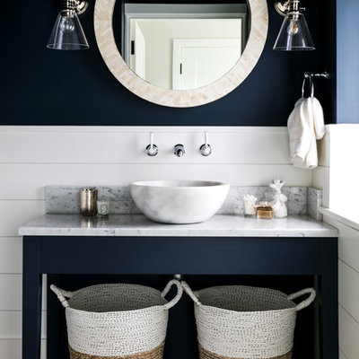 Inspiration for a coastal dark wood floor and brown floor bathroom remodel in London with blue walls, a vessel sink, marble countertops and white countertops