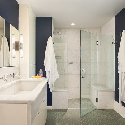 Elegant white tile gray floor alcove shower photo in Philadelphia with a trough sink, white cabinets, blue walls and a hinged shower door