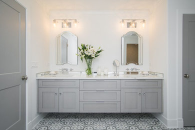 Inspiration for a large farmhouse master mirror tile cement tile floor bathroom remodel in Chicago with shaker cabinets, gray cabinets, a two-piece toilet, white walls, an undermount sink and quartz countertops