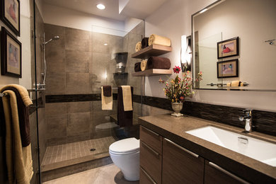 Example of a trendy porcelain tile bathroom design in Denver with an undermount sink and brown countertops
