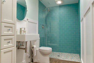 Mid-sized beach style blue tile and glass tile ceramic tile and brown floor bathroom photo in Raleigh with a wall-mount sink