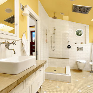 Mid-sized victorian master bathroom in Seattle with white cabinets, a claw-foot tub, an open shower, a wall-mount toilet, white tile, subway tile, yellow walls, plywood floors, a console sink, granite benchtops, multi-coloured floor, an open shower and beige benchtops.
