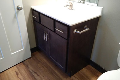 This is an example of a small classic family bathroom in Cedar Rapids with shaker cabinets, grey cabinets, vinyl flooring, an integrated sink and brown floors.
