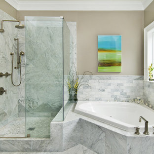 Inspiration for a transitional stone tile corner bathtub remodel in San Francisco