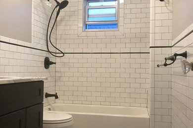 Inspiration for a white tile bathroom remodel in New York with gray walls