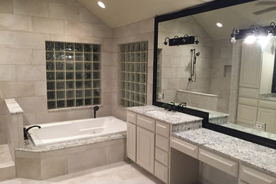 Example of a mid-sized transitional master beige tile and porcelain tile porcelain tile bathroom design in Houston with beaded inset cabinets, beige cabinets, beige walls, an undermount sink and granite countertops