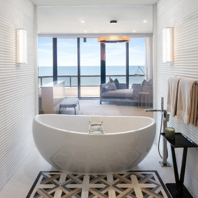 Freestanding bathtub - contemporary white tile beige floor freestanding bathtub idea in Tampa