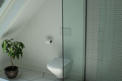 Large minimalist master black and white tile and cement tile ceramic tile, white floor, single-sink and vaulted ceiling bathroom photo in Montreal with flat-panel cabinets, medium tone wood cabinets, a wall-mount toilet, white walls, an undermount sink, quartz countertops, white countertops and a floating vanity
