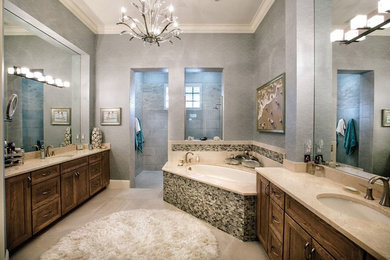 Bathroom - large transitional master multicolored tile and mosaic tile travertine floor and beige floor bathroom idea in Miami with recessed-panel cabinets, dark wood cabinets, gray walls, an undermount sink and marble countertops