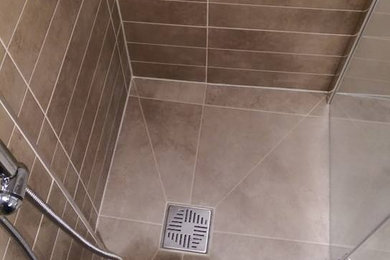 Inspiration for a medium sized contemporary bathroom in Oxfordshire with brown tiles, porcelain tiles and porcelain flooring.