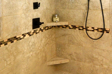Example of a mid-sized transitional master beige tile and ceramic tile ceramic tile doorless shower design in Charlotte with an undermount sink, raised-panel cabinets, white cabinets, granite countertops and green walls