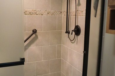 Inspiration for a mid-sized timeless master beige tile and porcelain tile alcove shower remodel in Chicago with a two-piece toilet