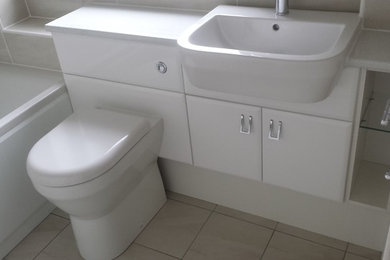 Inspiration for a small contemporary bathroom in Glasgow with an integrated sink, freestanding cabinets, white cabinets, laminate worktops, grey tiles, ceramic tiles, grey walls and ceramic flooring.