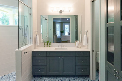 Doorless shower - mid-sized contemporary kids' blue tile and porcelain tile mosaic tile floor doorless shower idea in Tampa with an undermount sink, shaker cabinets, blue cabinets, quartz countertops and white walls