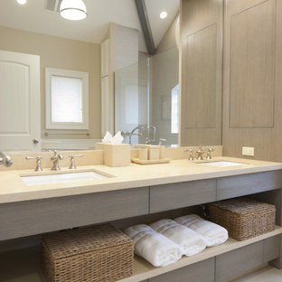 Mid-sized trendy master bathroom photo in New York with an undermount sink, gray cabinets and limestone countertops