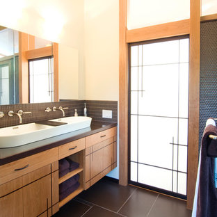 Example of a trendy gray tile and mosaic tile bathroom design in San Francisco with a trough sink, flat-panel cabinets, medium tone wood cabinets and beige walls
