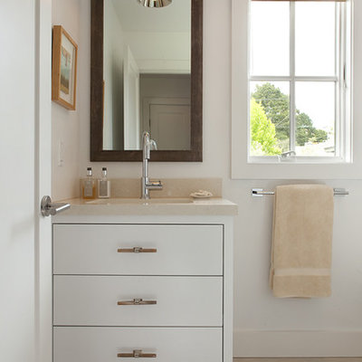 Inspiration for a contemporary bathroom remodel in San Francisco with an undermount sink, flat-panel cabinets and white cabinets