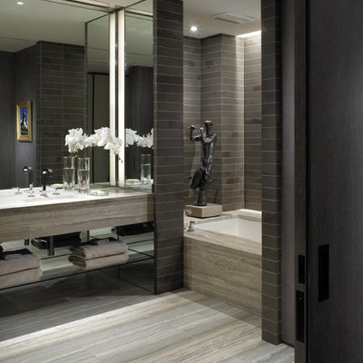 Alcove bathtub - contemporary gray tile alcove bathtub idea in New York with open cabinets