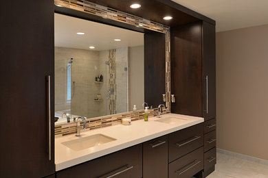 Inspiration for a contemporary beige tile tub/shower combo remodel in Philadelphia with an undermount sink, flat-panel cabinets and dark wood cabinets