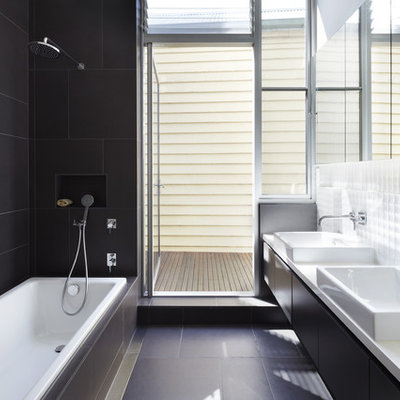 Example of a trendy 3/4 black tile and white tile black floor bathroom design in Melbourne with flat-panel cabinets, black cabinets and a console sink