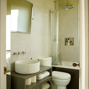 Design ideas for a contemporary shower room bathroom in London with glass-front cabinets, grey cabinets, an alcove bath, a shower/bath combination, white tiles, mosaic tiles, mosaic tile flooring, a vessel sink, white floors and grey worktops.
