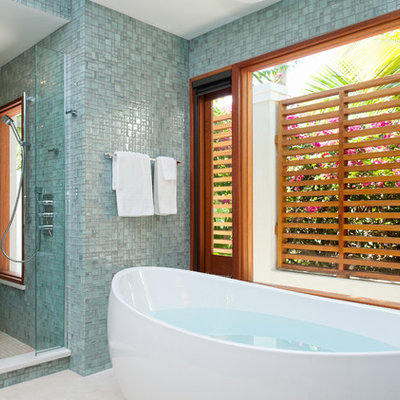 Example of a trendy mosaic tile freestanding bathtub design in Denver