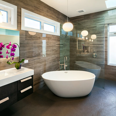 Trendy brown tile and porcelain tile bathroom photo in San Francisco with an undermount sink, flat-panel cabinets, dark wood cabinets and white countertops