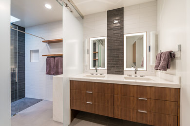 Inspiration for a mid-sized contemporary master white tile alcove shower remodel in San Francisco with an undermount sink, flat-panel cabinets, dark wood cabinets and white walls