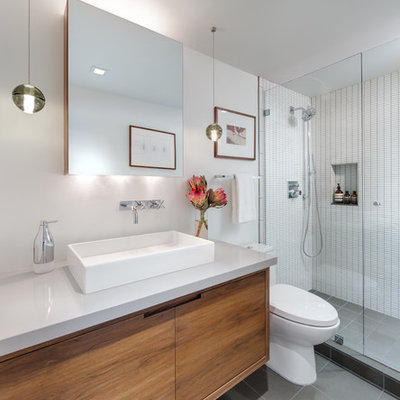Alcove shower - small contemporary 3/4 white tile and ceramic tile porcelain tile alcove shower idea in Los Angeles with a vessel sink, medium tone wood cabinets, quartz countertops, a one-piece toilet, white walls and gray countertops